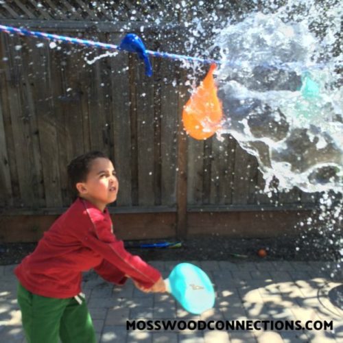 Pendulum Water Blast: a Visual Tracking Activity #mosswoodconnections #visiongames #visualtracking #grossmotor #sensory